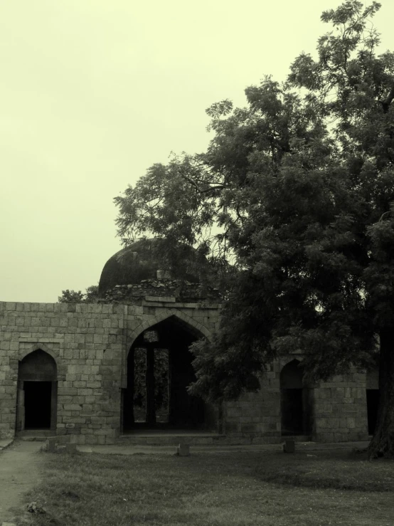 a very old looking building near some trees