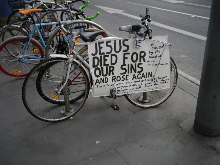 a sign saying jesus died for our singles and rose again