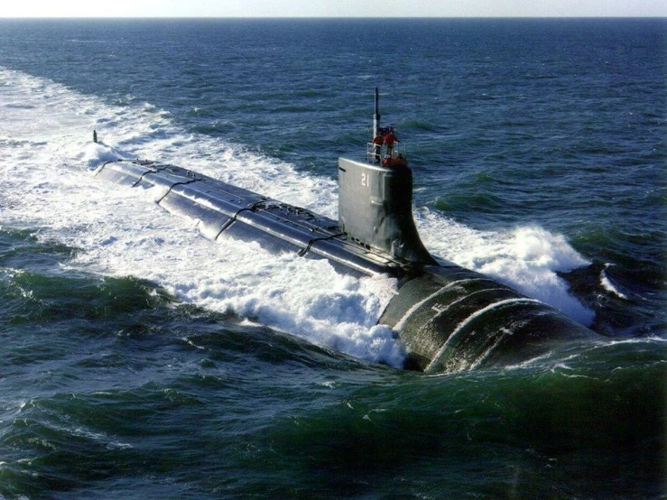 the submarine is traveling through the ocean