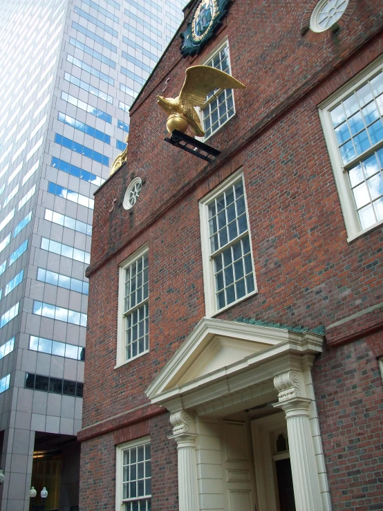 the view of a clock tower on a building's front