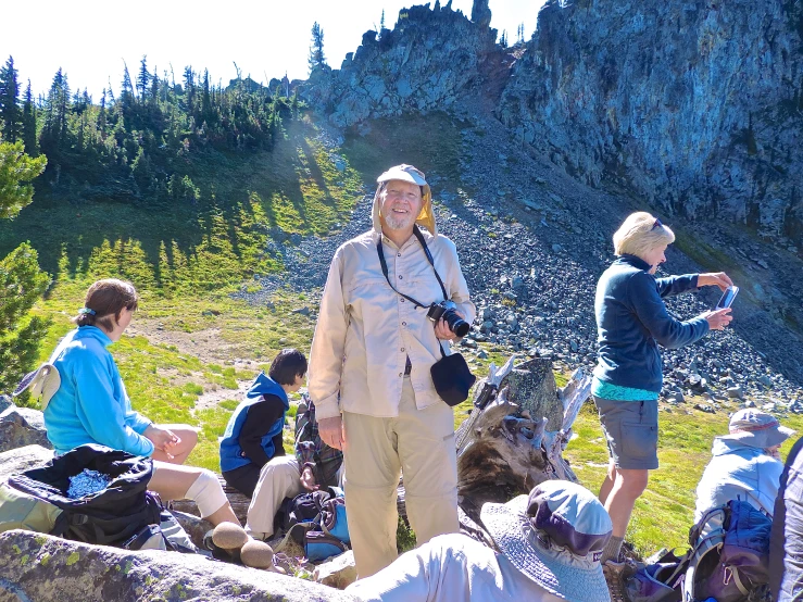 a man standing next to a crowd of people