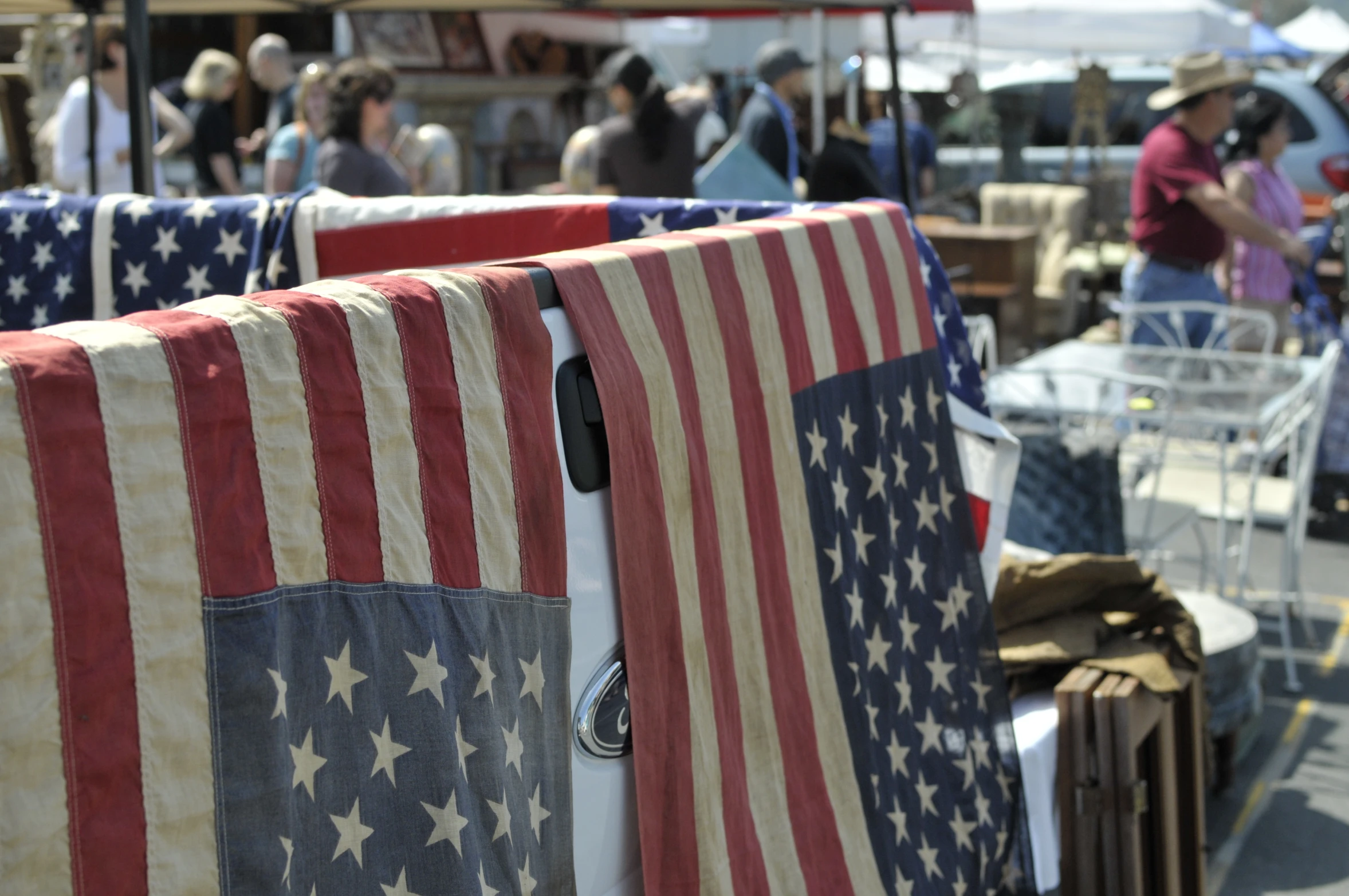 some flags that are hanging on clothes lines