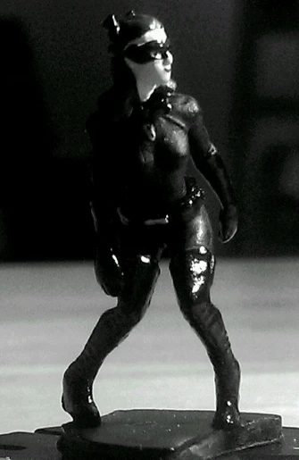 a figurine of a catwoman in wetsuit with goggles
