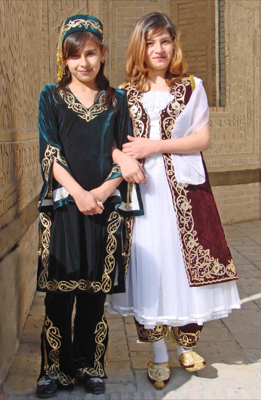 two young women dressed in traditional attire