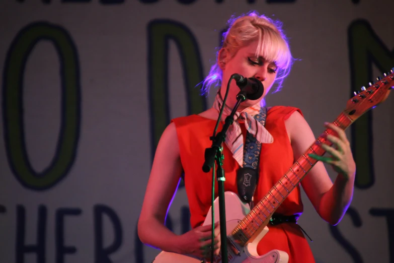 a woman that has a guitar in her hands