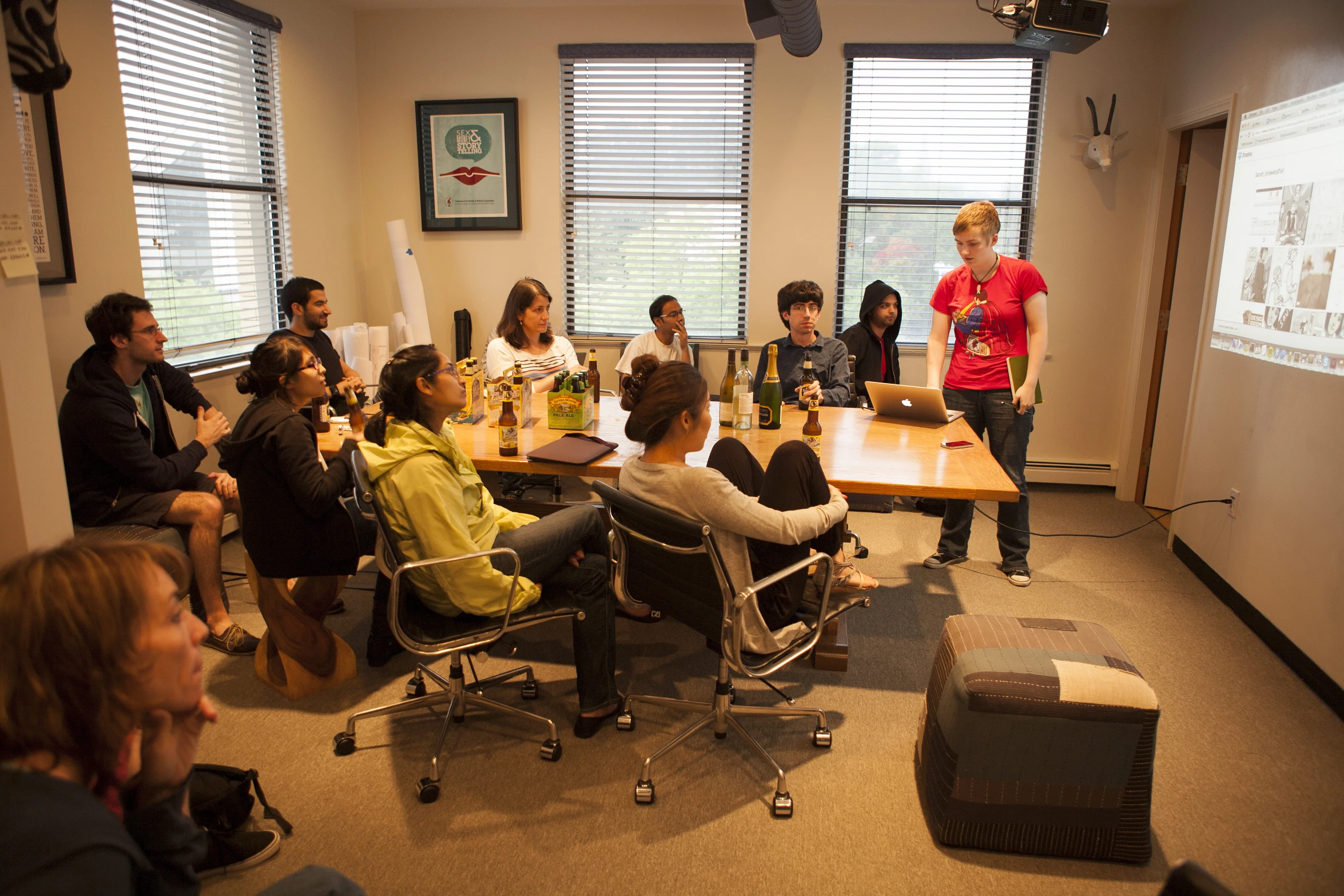 several people are having an meeting in a conference room