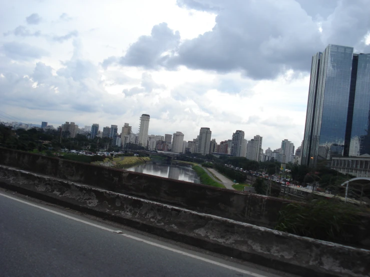 buildings, street lights and a bridge overlook the city