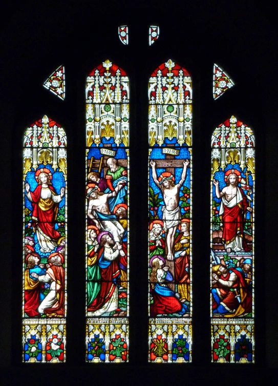 stained glass windows in the front of a church