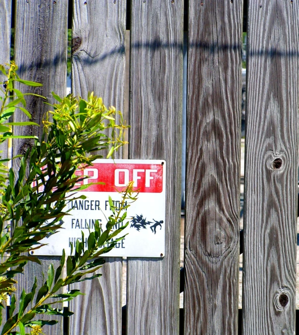 there is a sign on a fence stating 2 % off