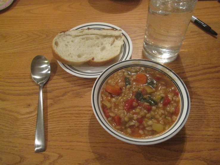 a bowl and a glass sitting on a table