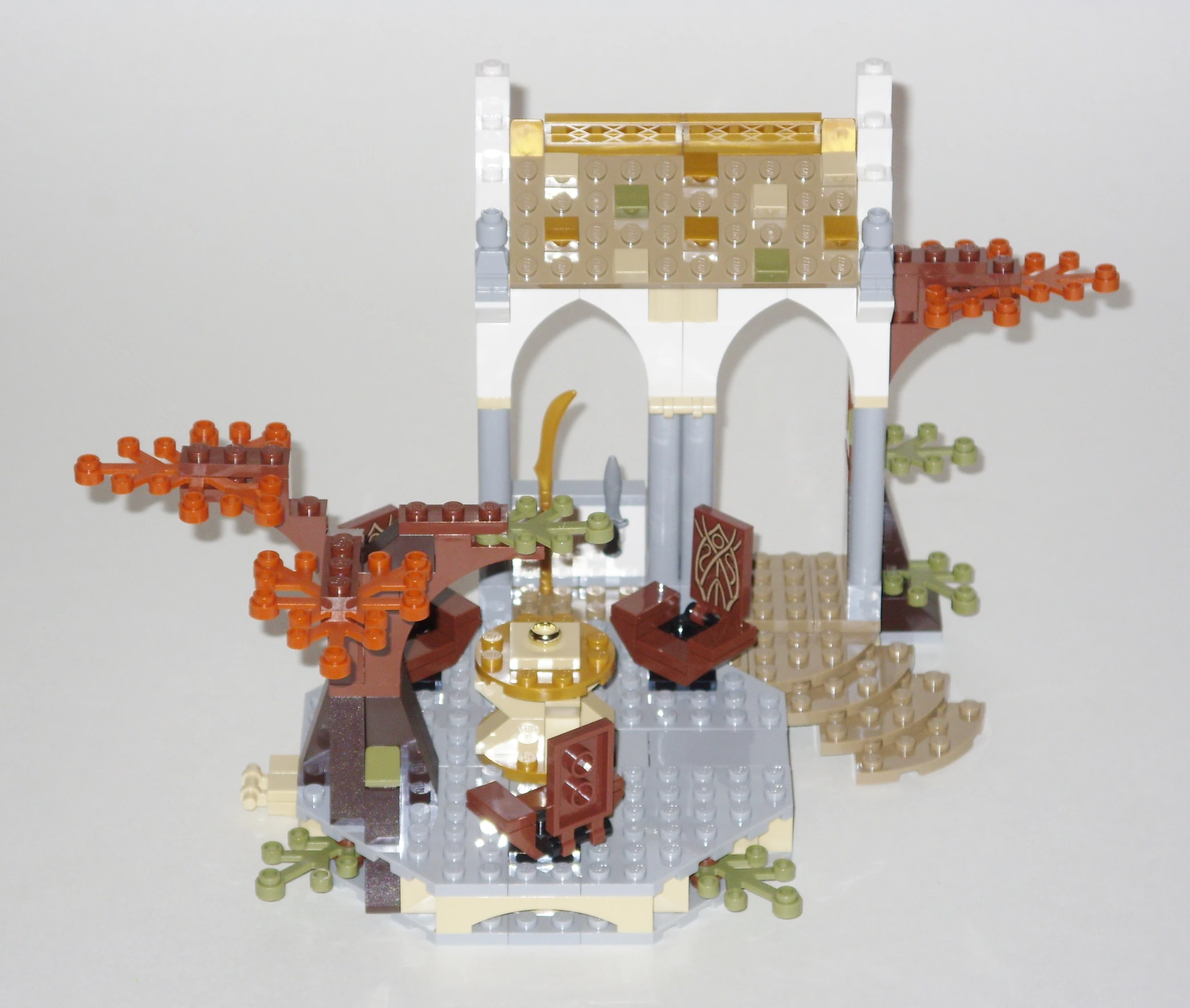 a lego castle with a clock and people in it