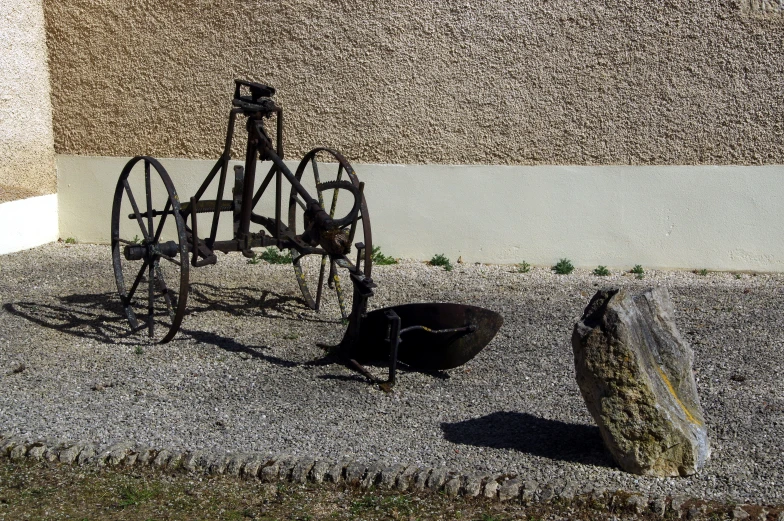 an old horse and buggy outside of a building