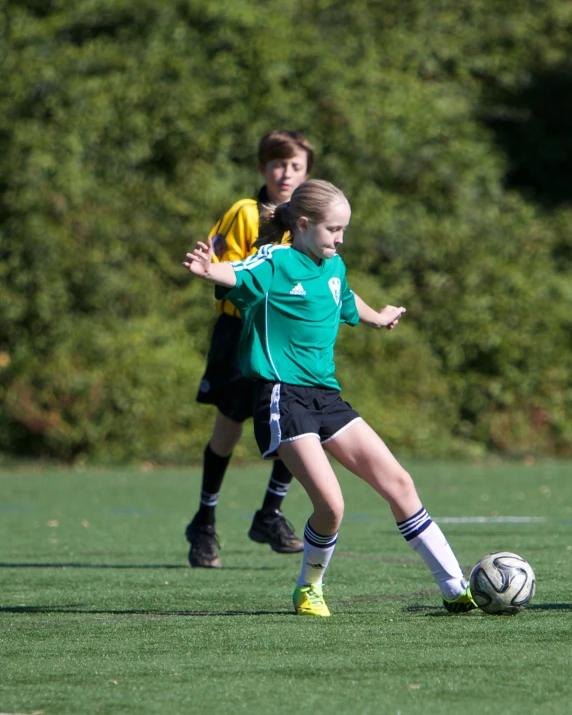 two s playing a game of soccer