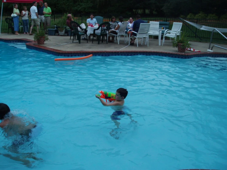 a  playing in the water with a large toy