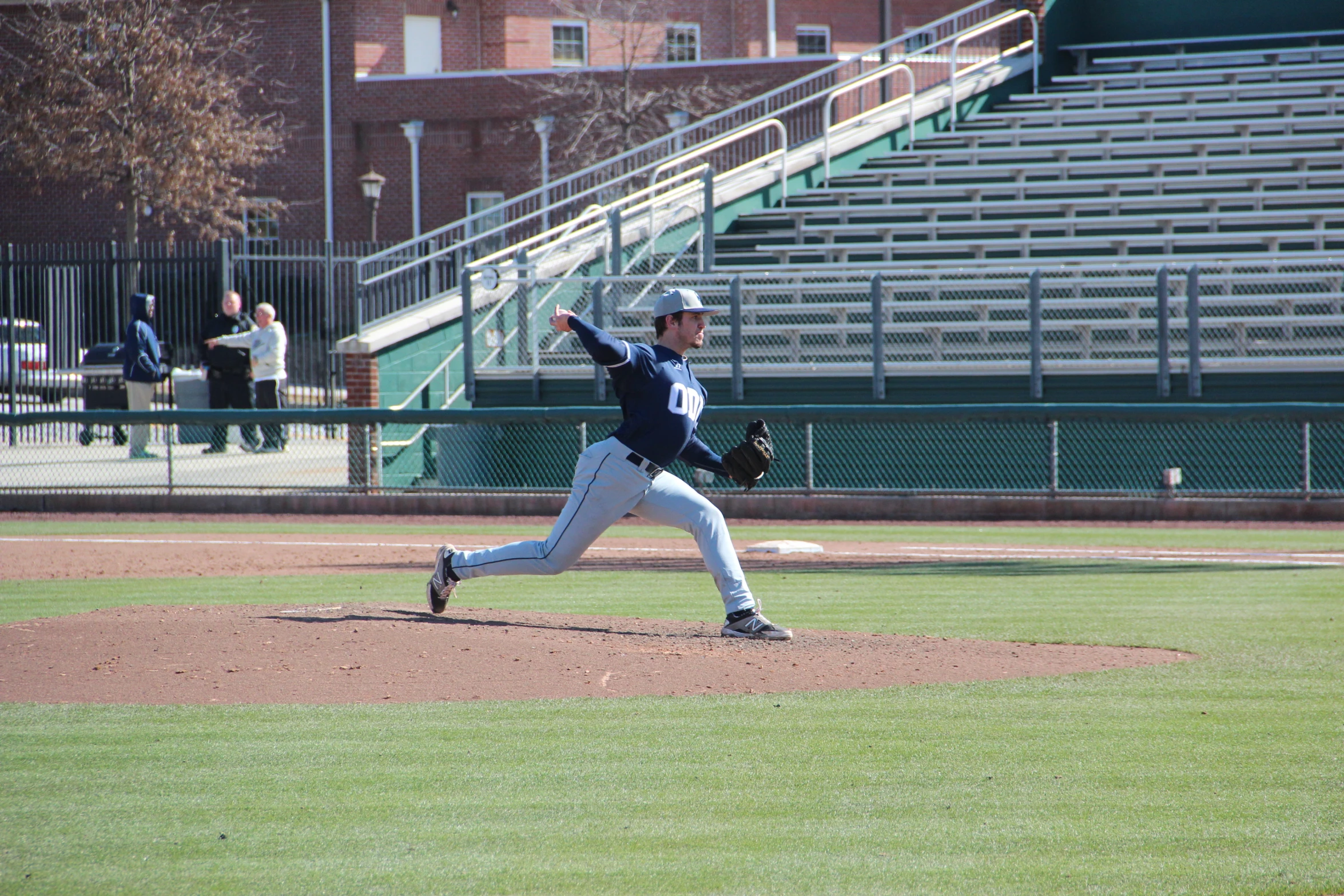 a baseball player winding up to throw a ball