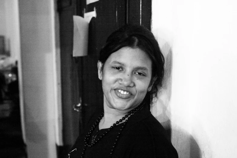 black and white pograph of a woman with a smile on her face