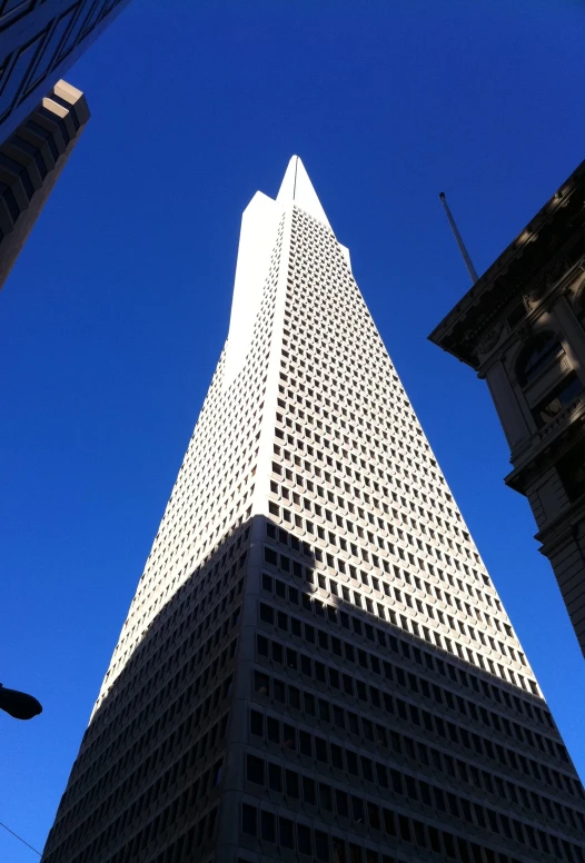 a very tall building with a sky background