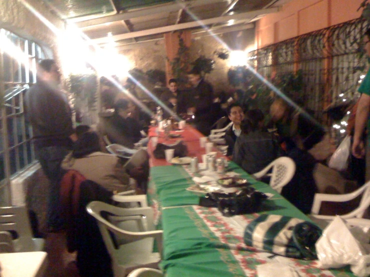 a very long table with many people around it