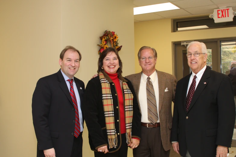 several business people dressed up smiling for the camera