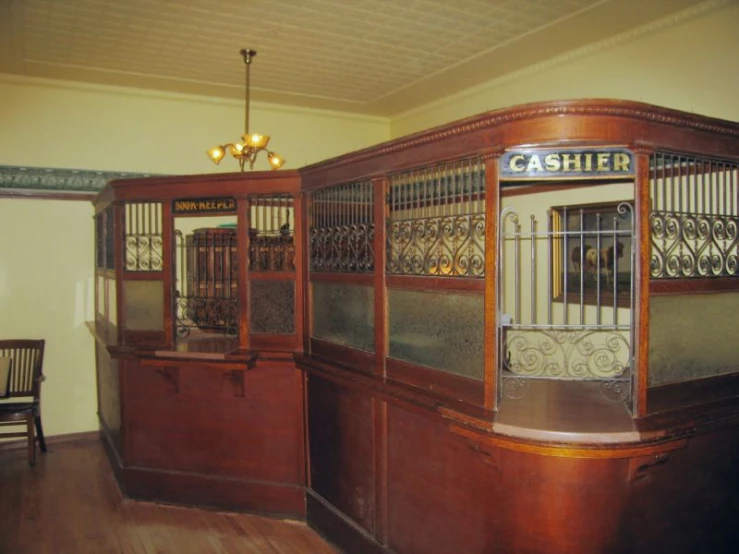 wooden train carriage with windows that have bars