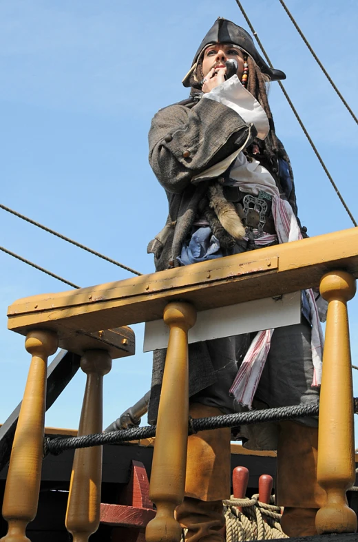 a pirate looking over the deck of a ship