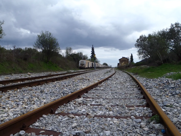 a railroad track that runs between buildings