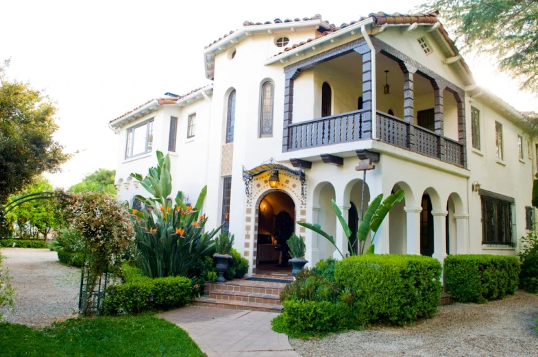 an outdoor view of a mansion that is decorated