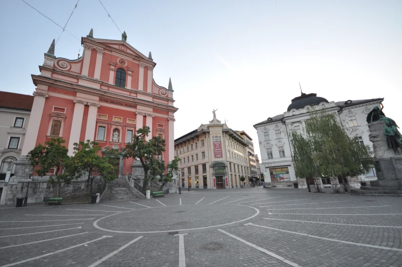 a building that is pink and white is shown