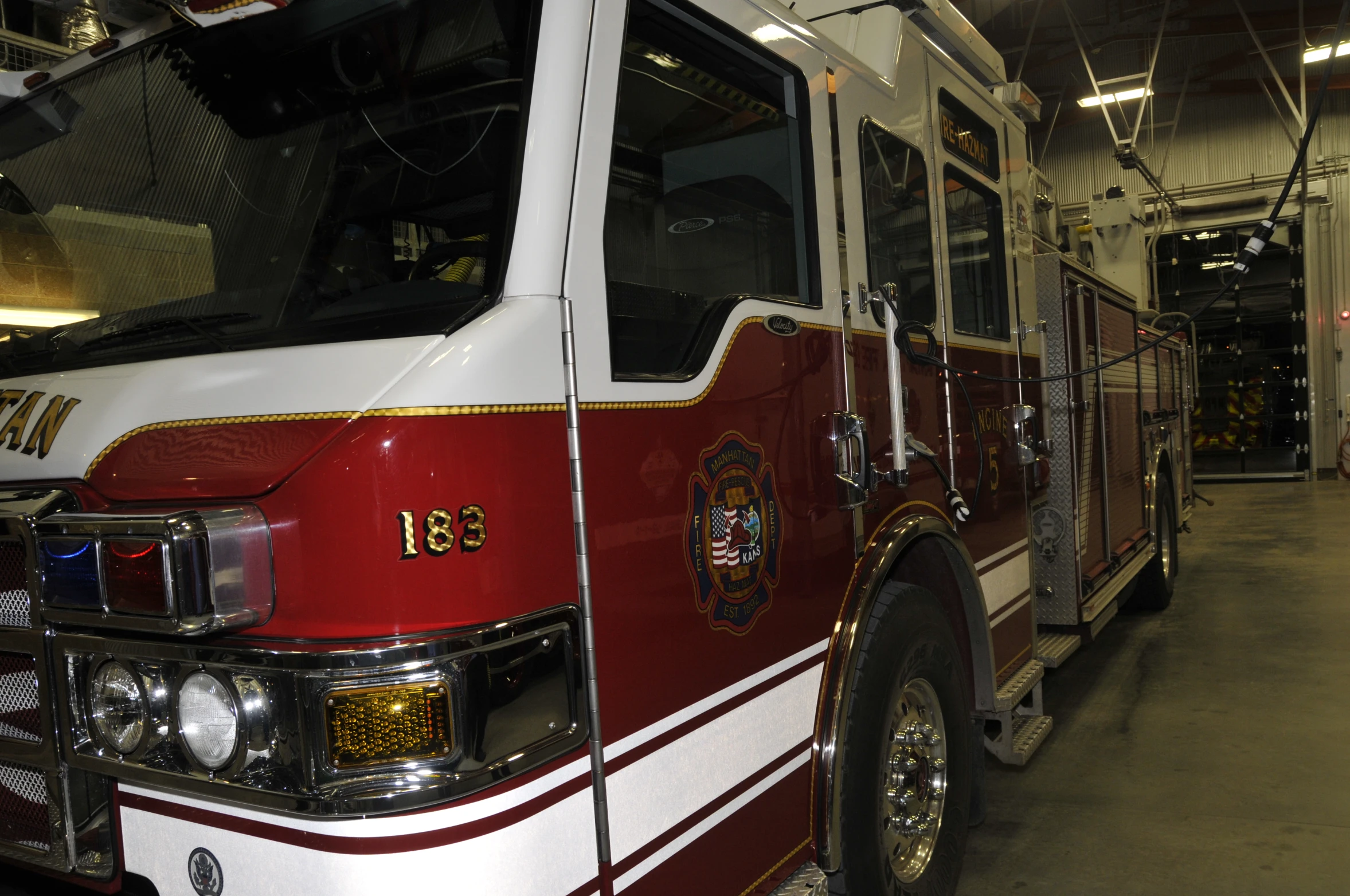 a fire truck parked in the garage near its destination