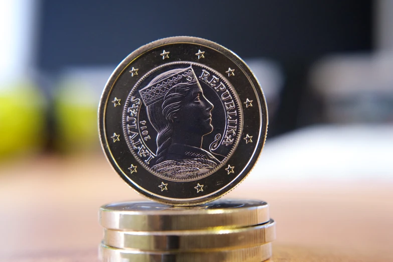 a coin on top of some stacked coins