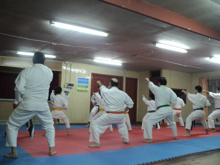people practicing karate at an indoor gym