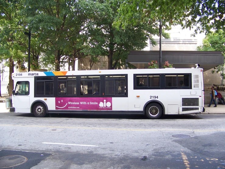 a long bus parked along a city street