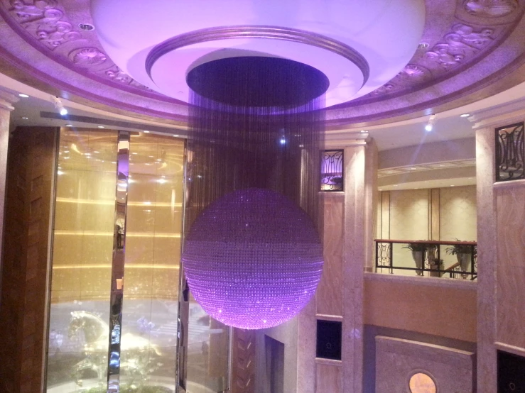 inside an elevator in a building with purple lighting