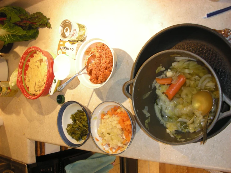 several bowls of food on a counter top