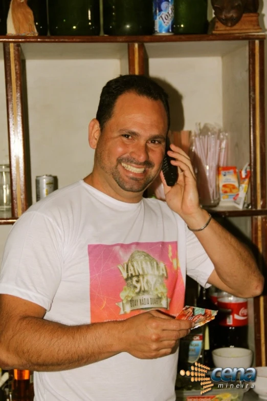 man in a t - shirt is on the phone