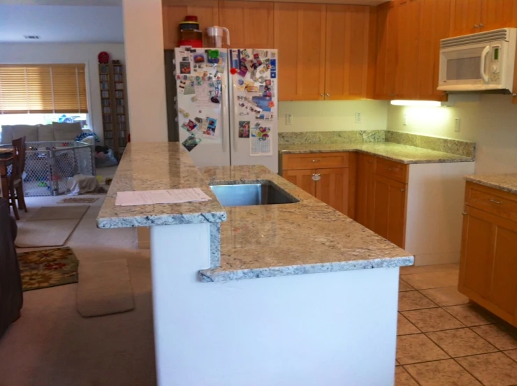 a kitchen with lots of counter space and granite counter tops