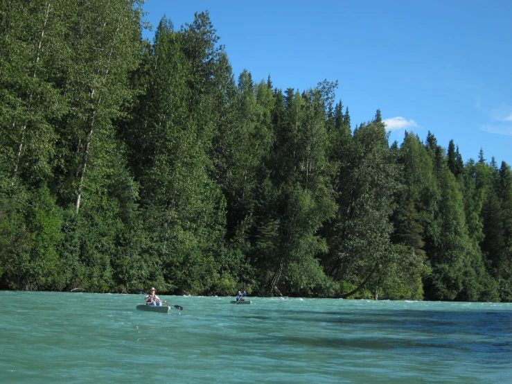 the two people are enjoying their day in the water