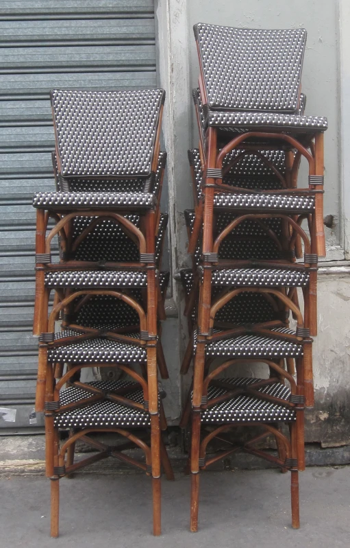 a couple of chairs are stacked against the wall