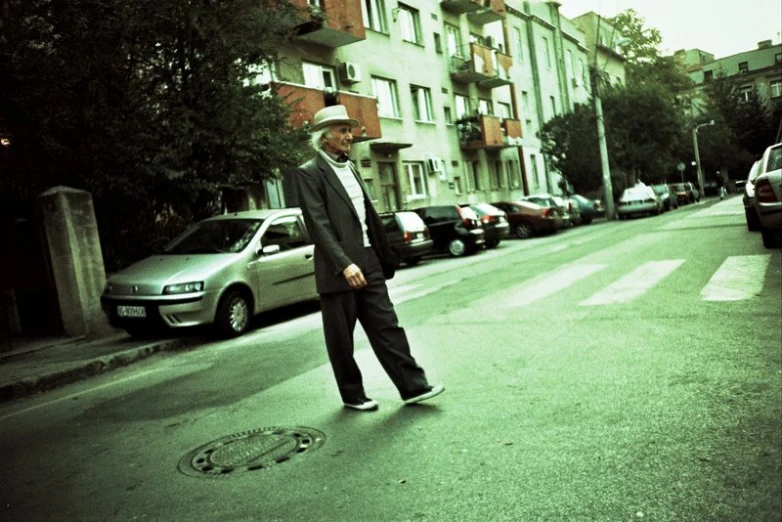 a man that is standing up on the side of a road