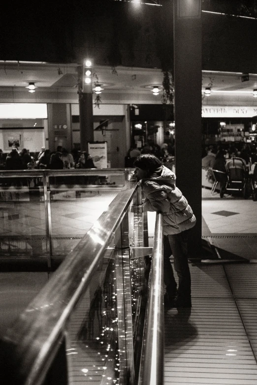 a black and white po shows people at night