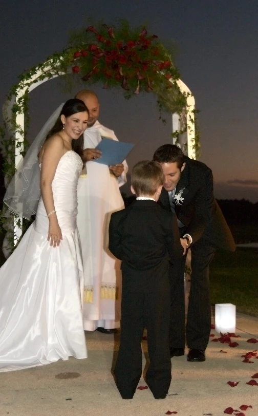 an image of a bride and groom exchanging vows at their outdoor ceremony