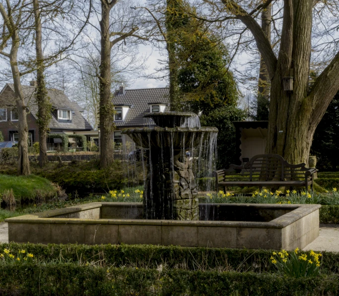 a large fountain in a park on a street