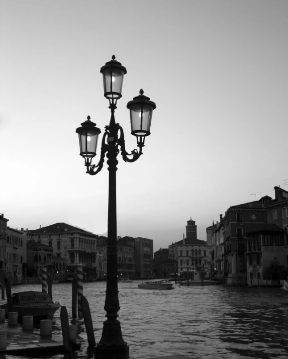 two street lights on a water front