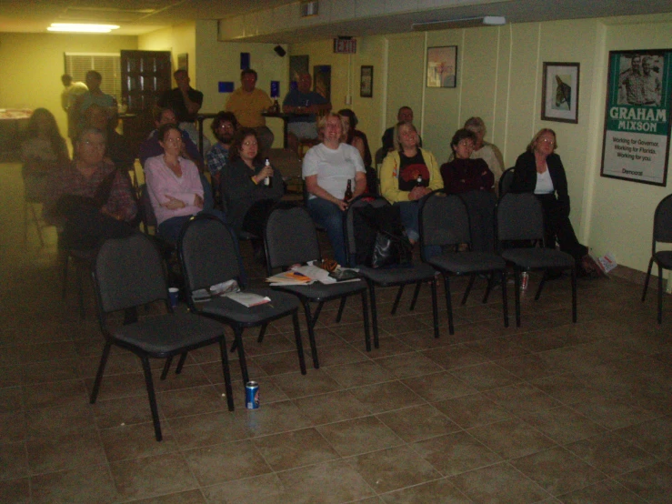 a group of people in a waiting room looking on