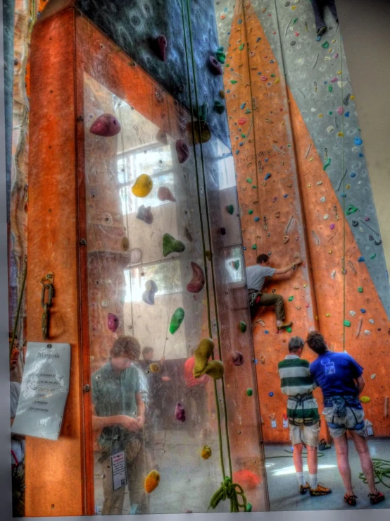 a man is climbing up the side of a building