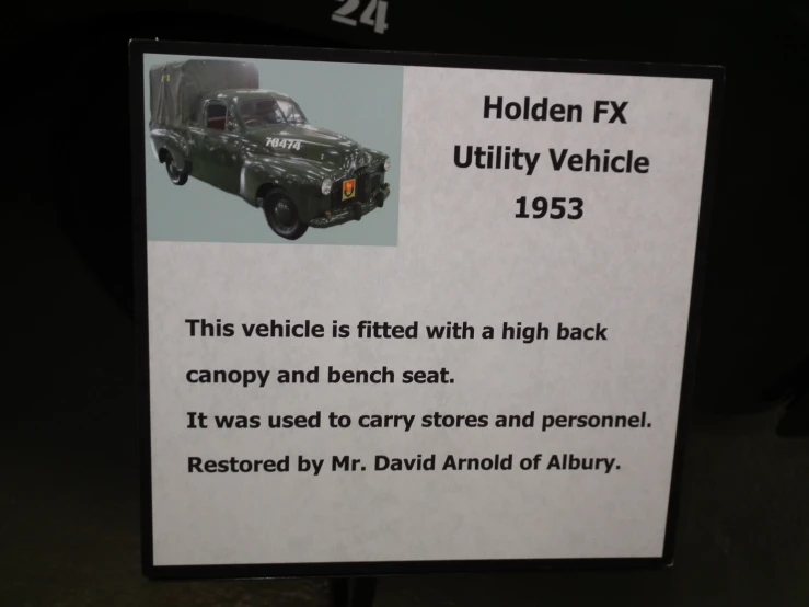 there is an information sign about cars and trucks