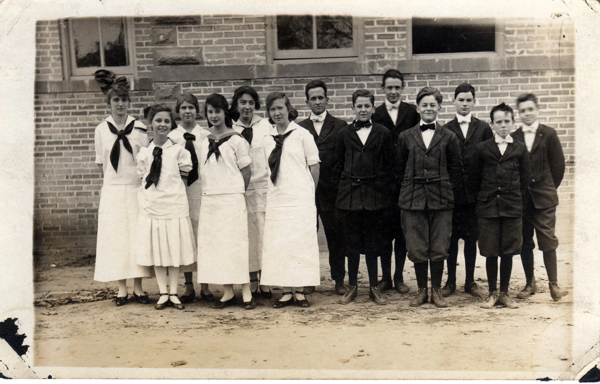 a group of men and women in old fashion