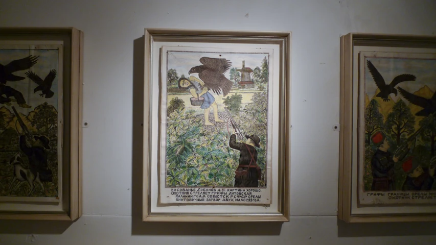 two framed paintings of animals and people in the forest