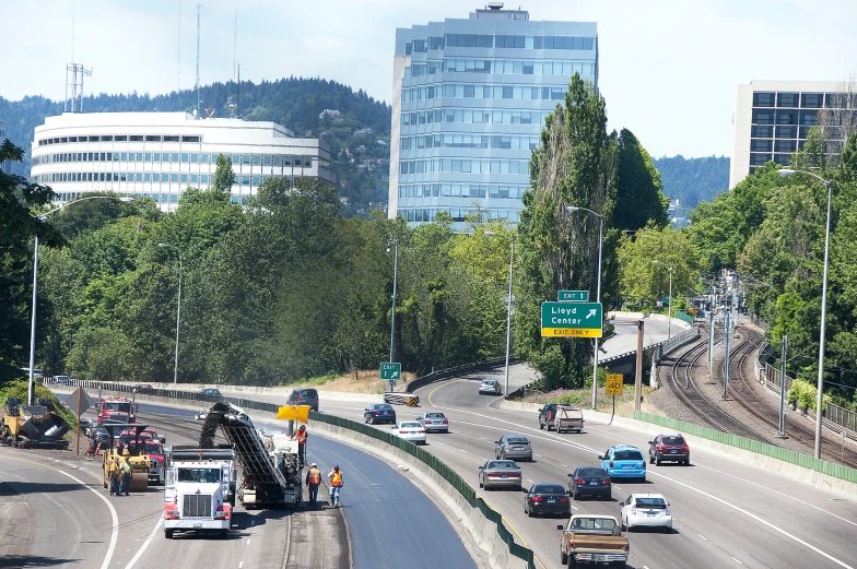 there are cars driving on a curved highway