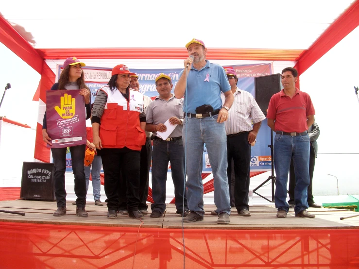 several people standing on top of a stage